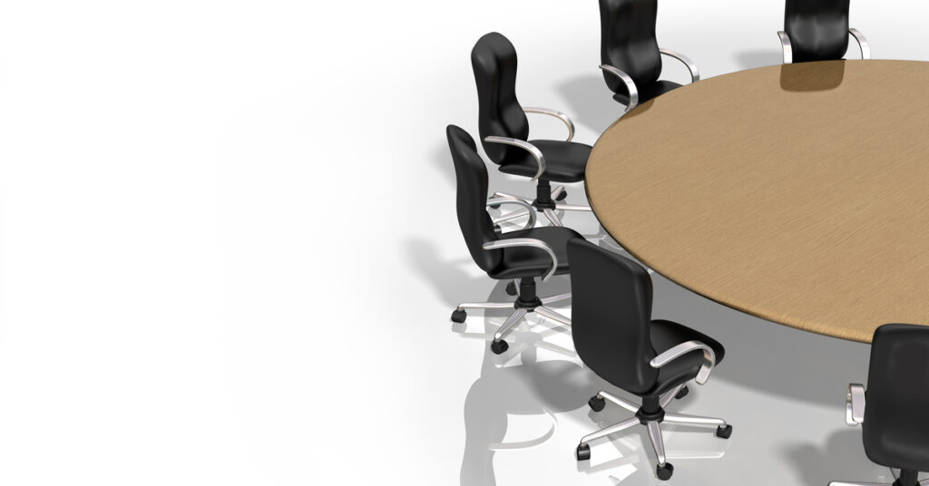 Office table with empty chairs